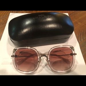 New and never worn Coach sunglasses.